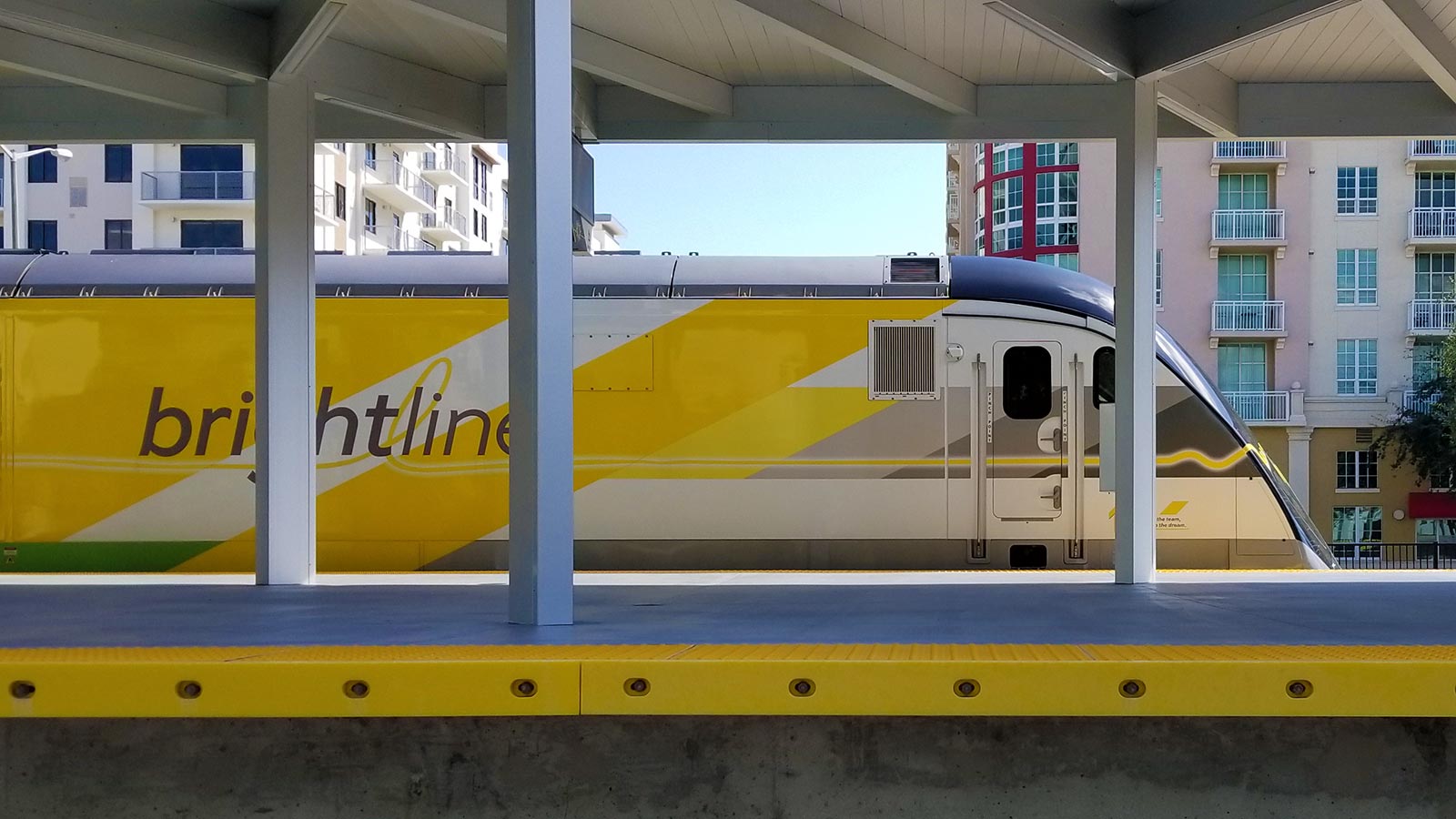 Brightline train standing at the West Palm Beach station.
