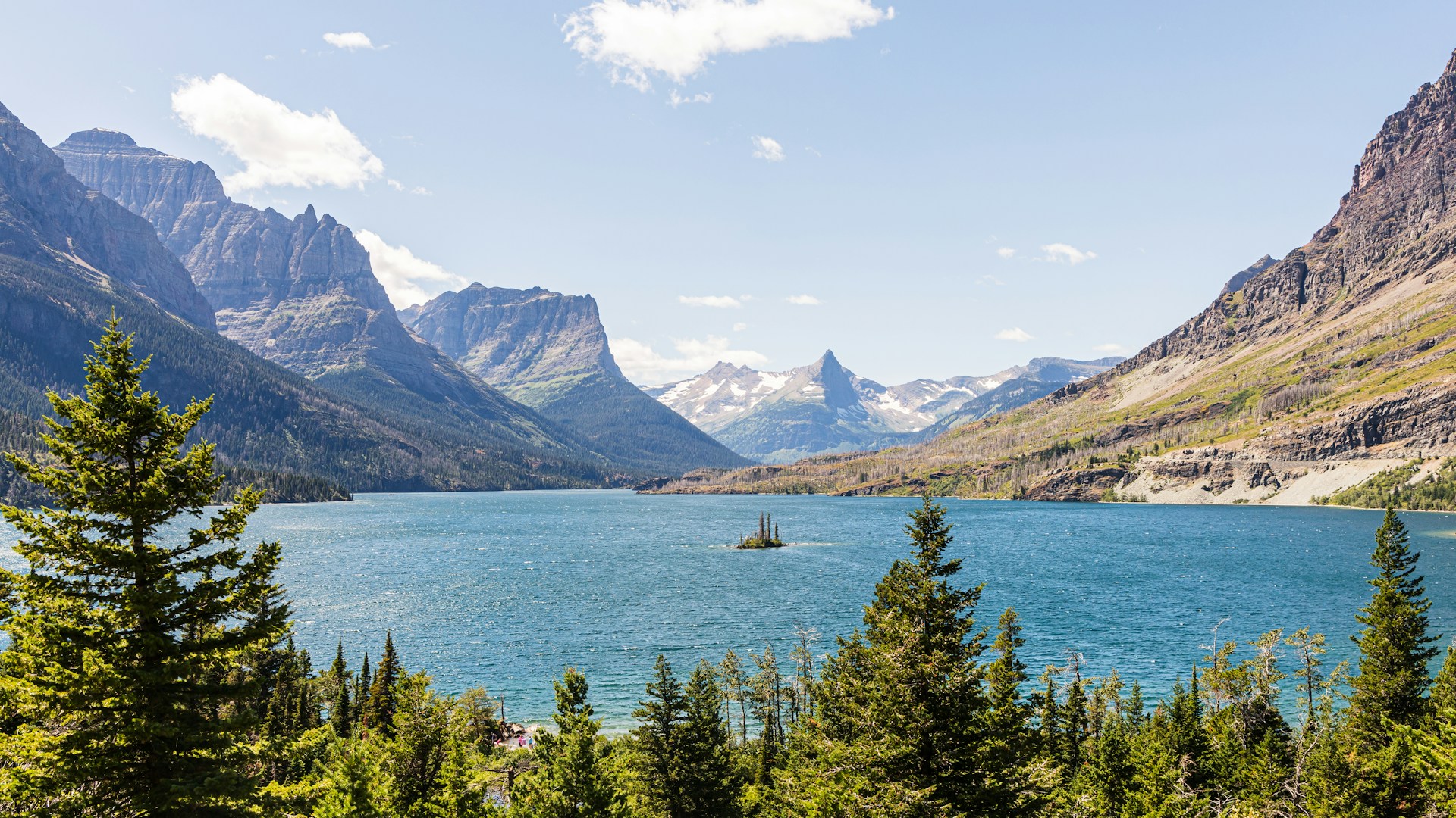 Crystal blue waters against a mountain terrain.