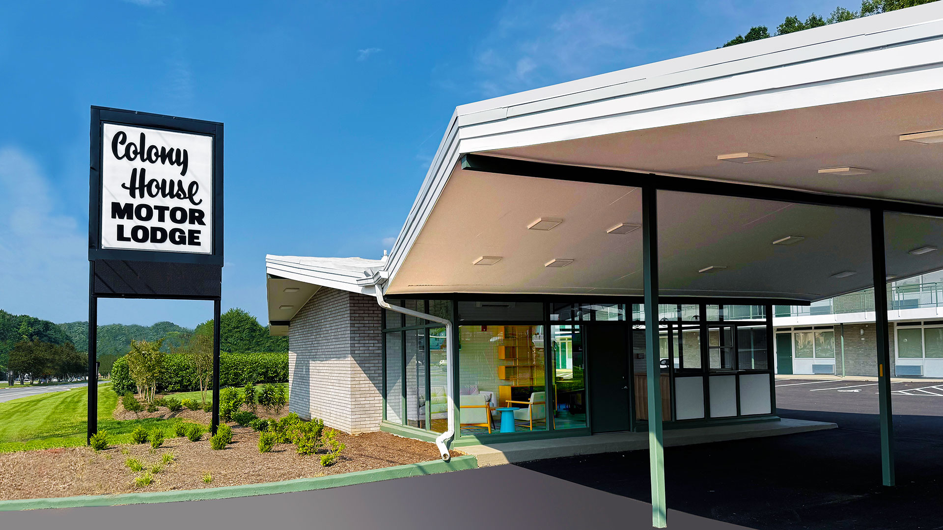 Historic white roofed motor lodge.
