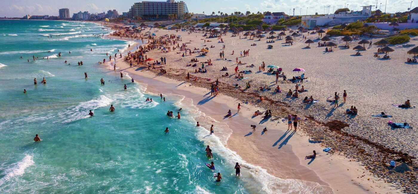 Crystal blue waters and sandy beach in Cancun, Mexico.