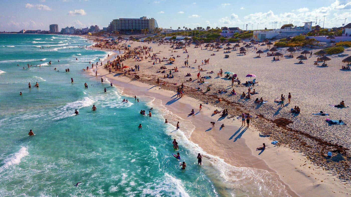 Crystal blue waters and sandy beach in Cancun, Mexico.