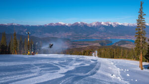 Freshly graded snow overlooking a mountain valley.