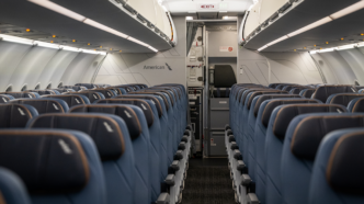 New interior of an American Airlines Airbus plane featuring various blue accents on the seats and carpet.