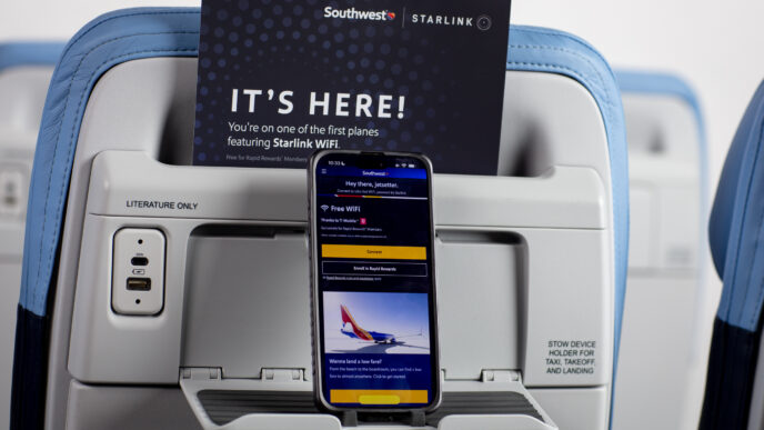 Mobile phone in the seat back on a aircraft showing it's connected to free wi-fi.
